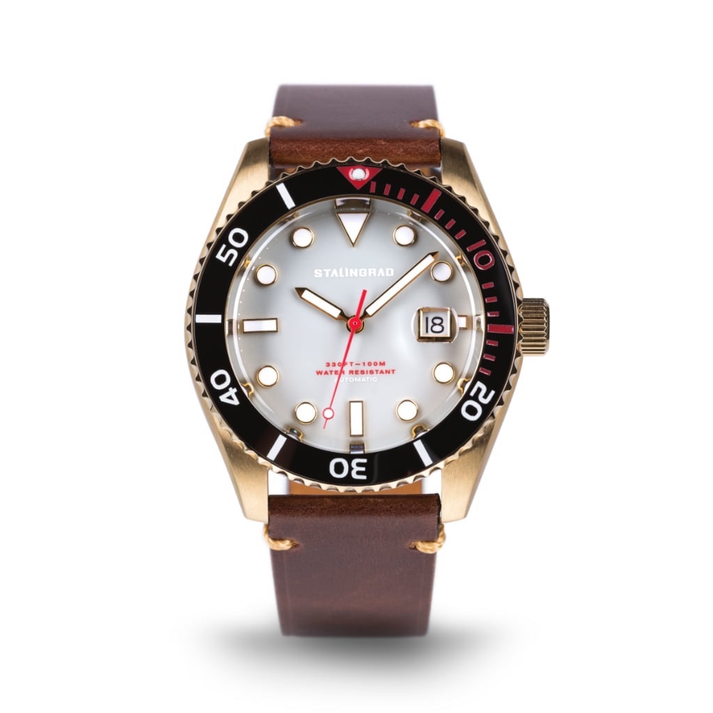 Stalingrad Volga defender automatic watch with a gold case and grey colour dial with red second hand in a brown leather strap, front view or watch on a white background