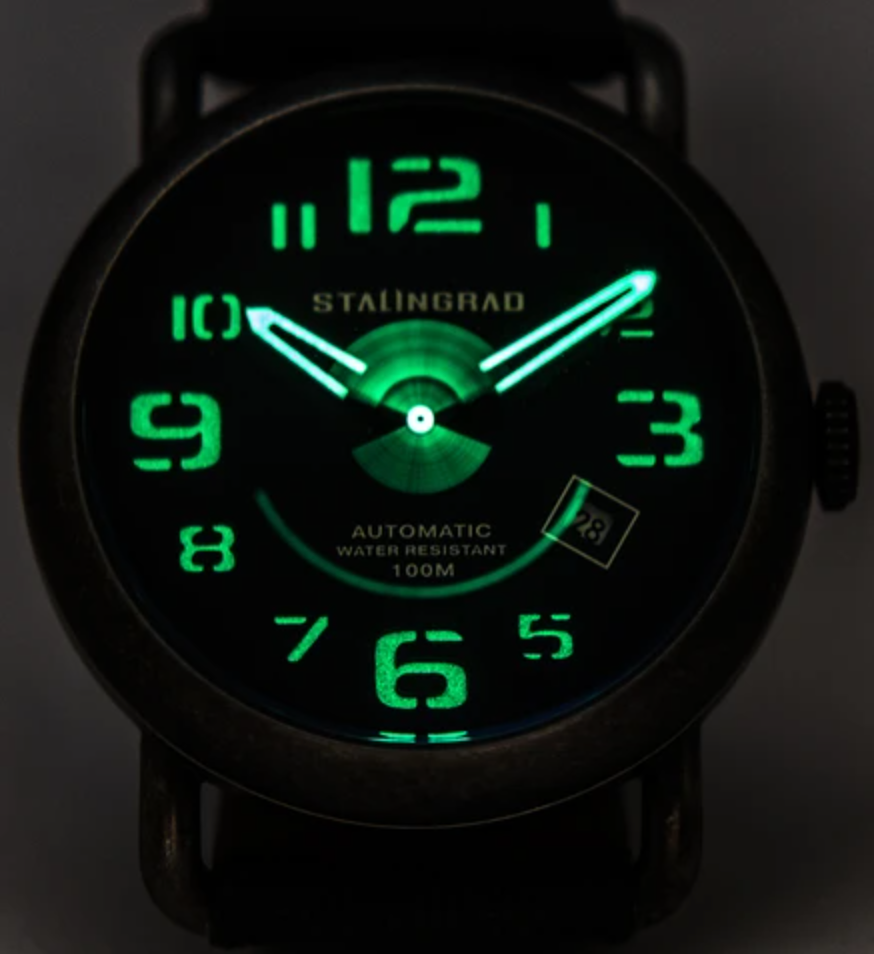 Stalingrad Rodim Watch Lume shot dark background with numbers and watch hand lit up in green